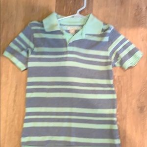 Teal and blue polo shirt.